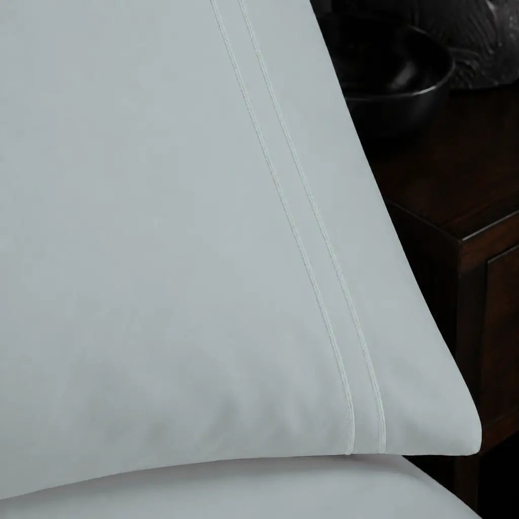 Close-up of white two-row satin stitch on the Duck Egg Polycotton Percale 200TC duvet cover set.