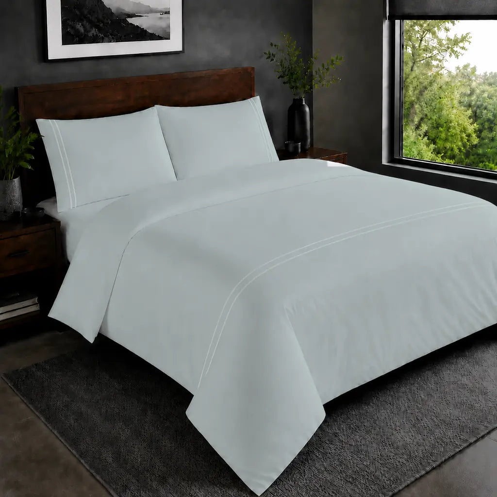 Duck Egg Polycotton Percale 200TC duvet cover set with white two-row satin stitch in the hero bedroom view.