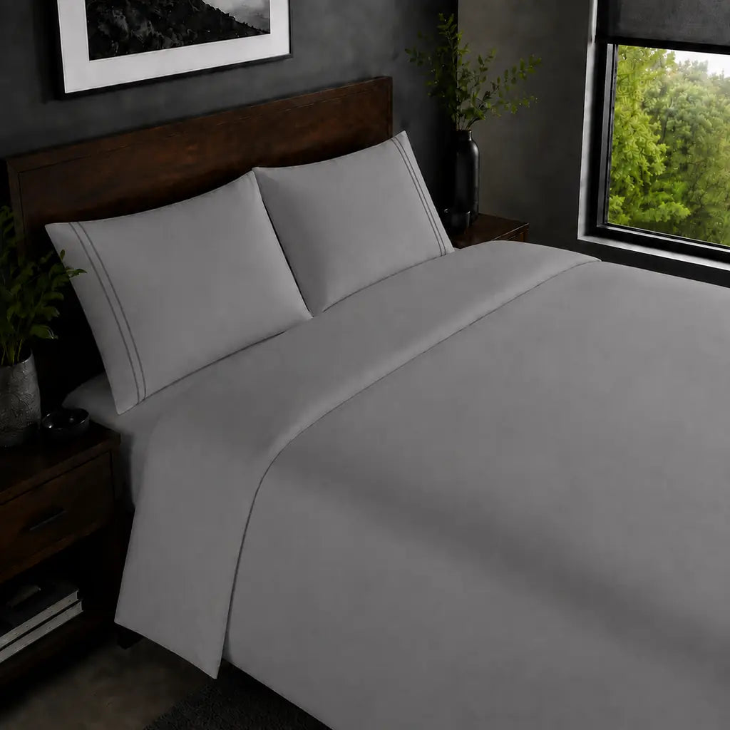 Grey 200TC plain duvet cover with Grey two row satin stitch - on the bed - Linen and Co