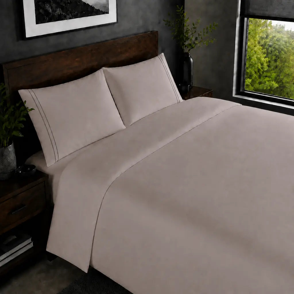 Stone 200TC plain duvet cover with Grey two row satin stitch - on the bed - Linen and Co