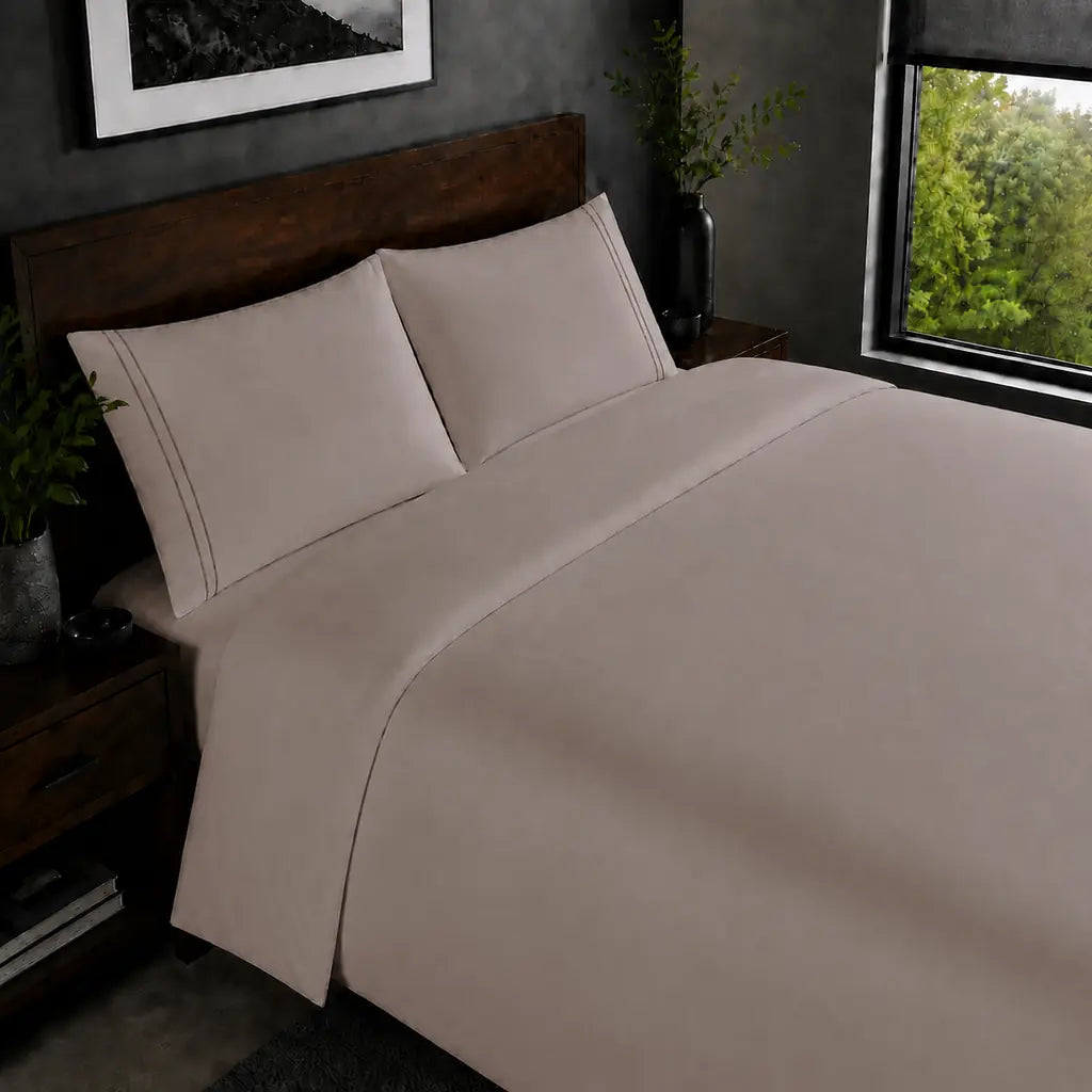 Stone 200TC plain duvet cover with Stone two row satin stitch - on the bed - Linen and Co