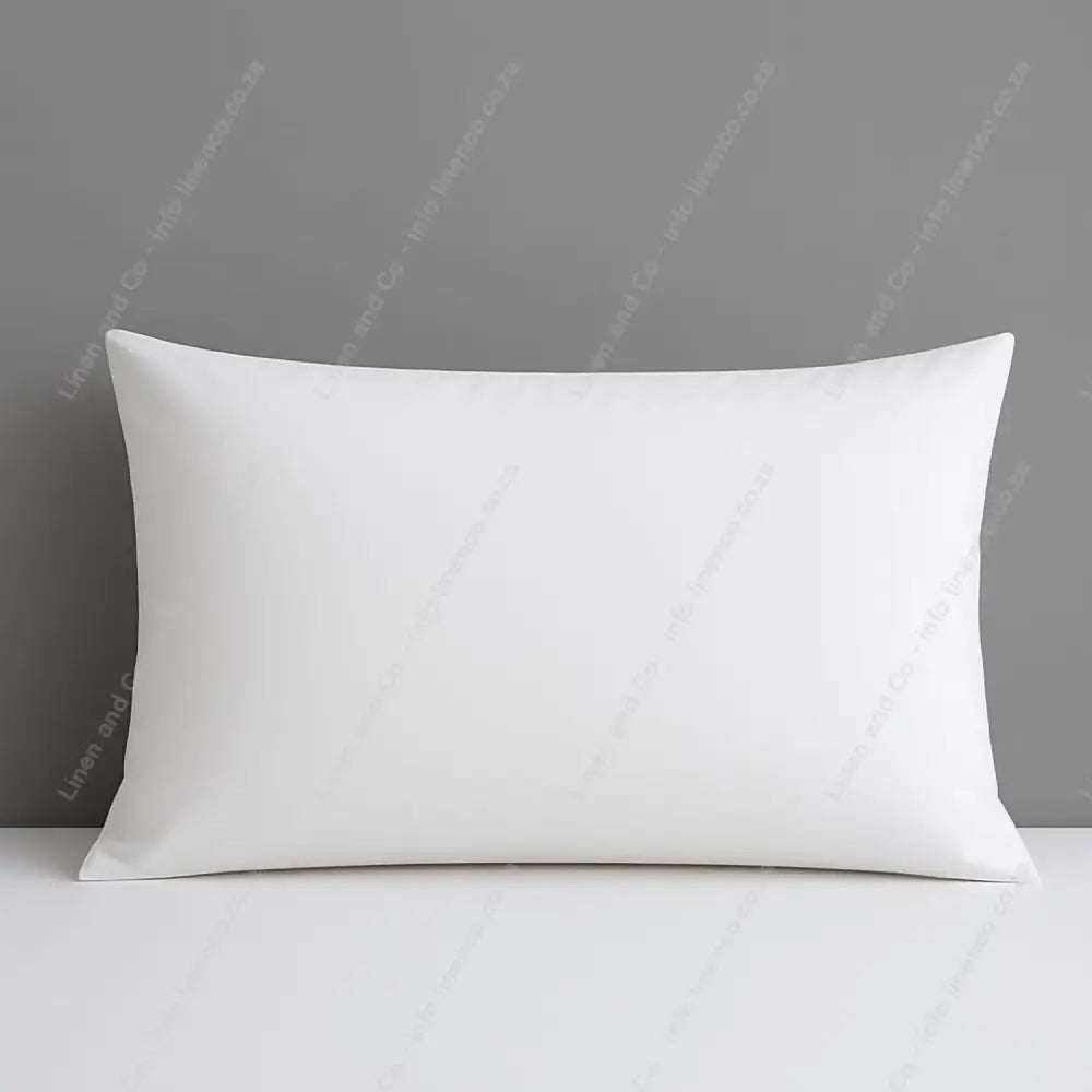 White pillow on a gray background