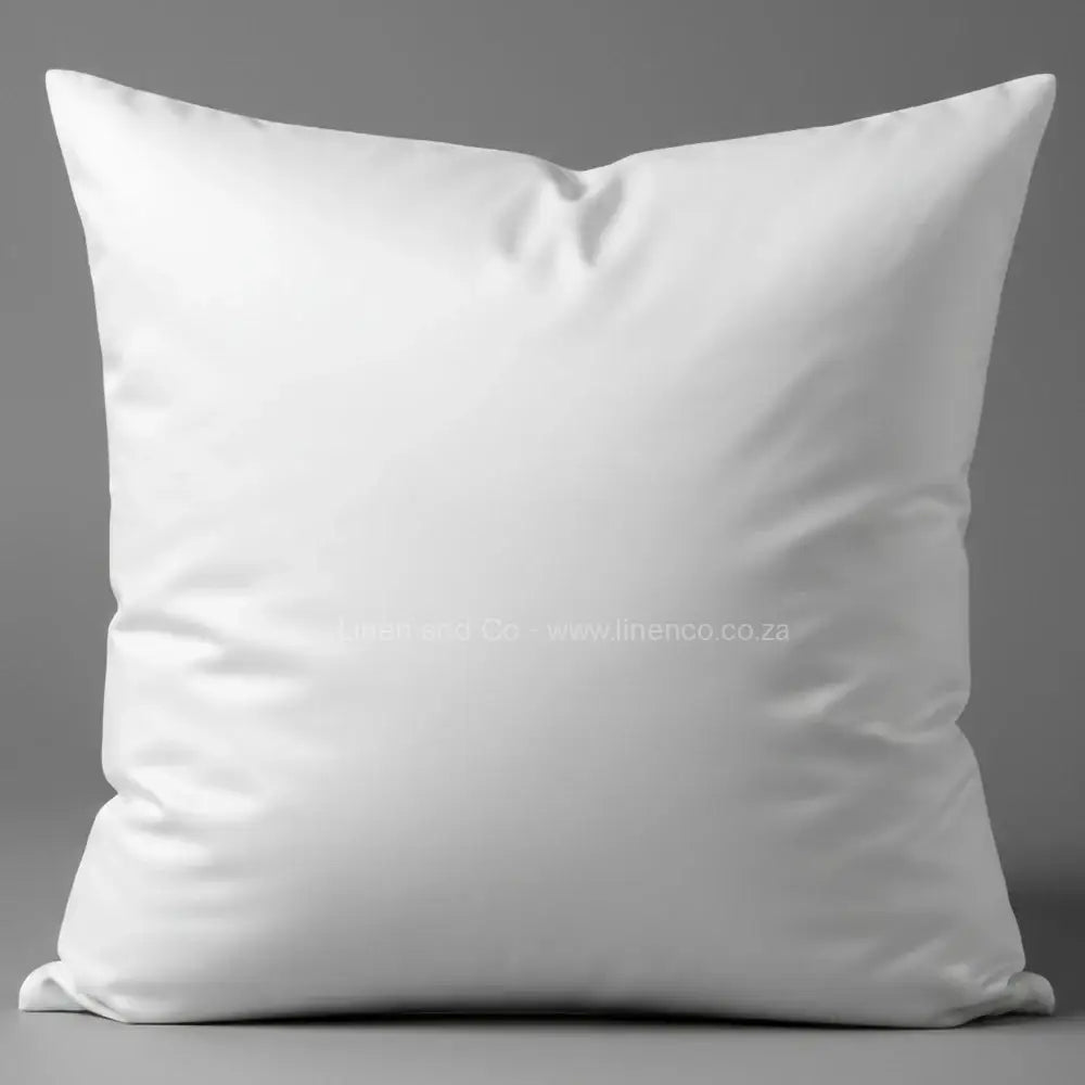 White luxury microfibre pillow from Linen and Co luxury hospitality collection, professional product photography showcasing premium pillow quality and comfort.