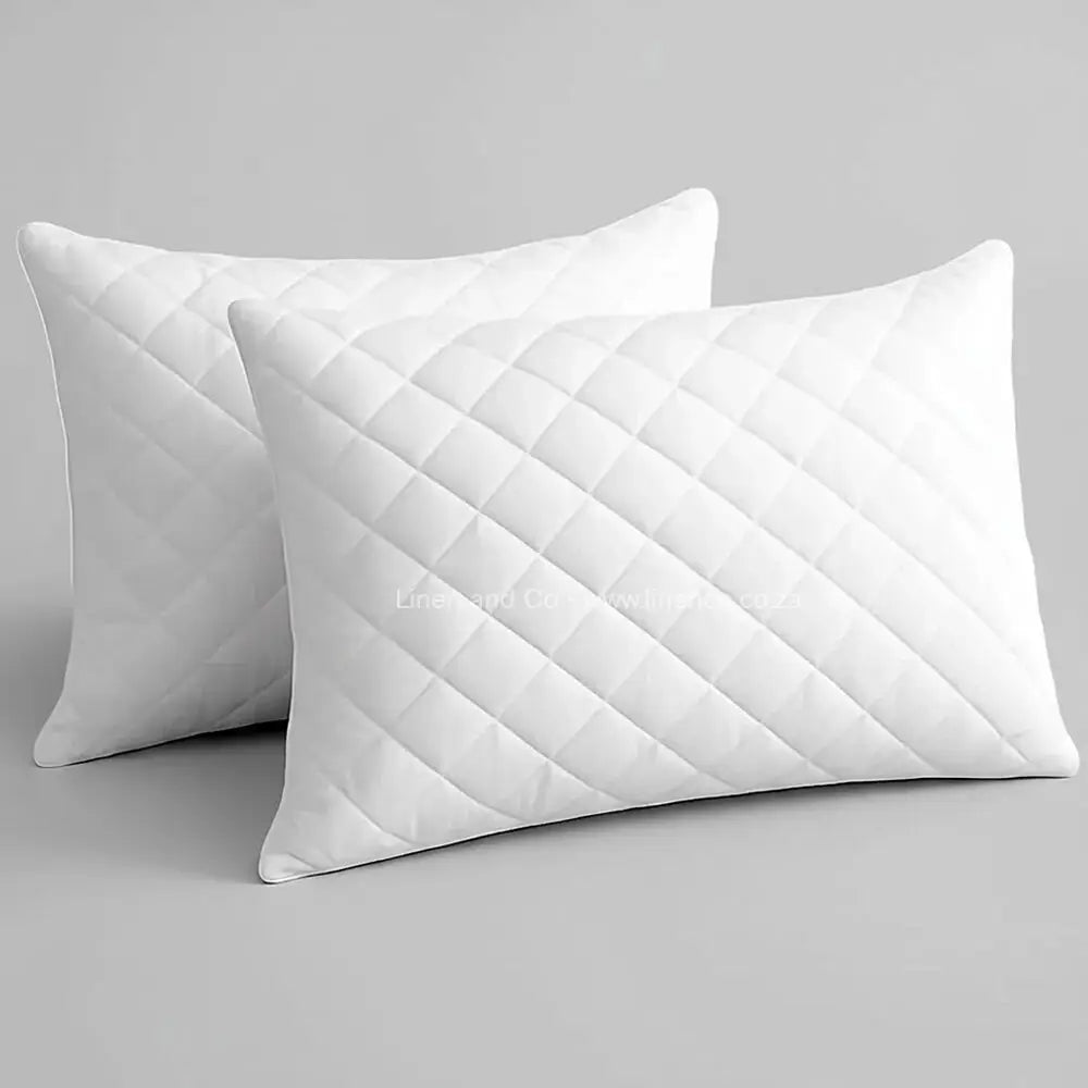 Quilted Wetsafe Pillow Protector in  – white quilted waterproof pillow cover with diamond quilting pattern, displayed on neutral background. Hospitality-grade, machine washable pillow protection by Linen & Co