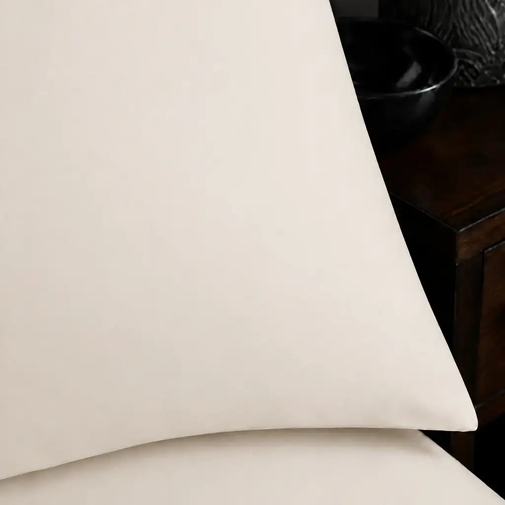 Close-up of cream pillowcase with no satin stitch border by Linen and Co