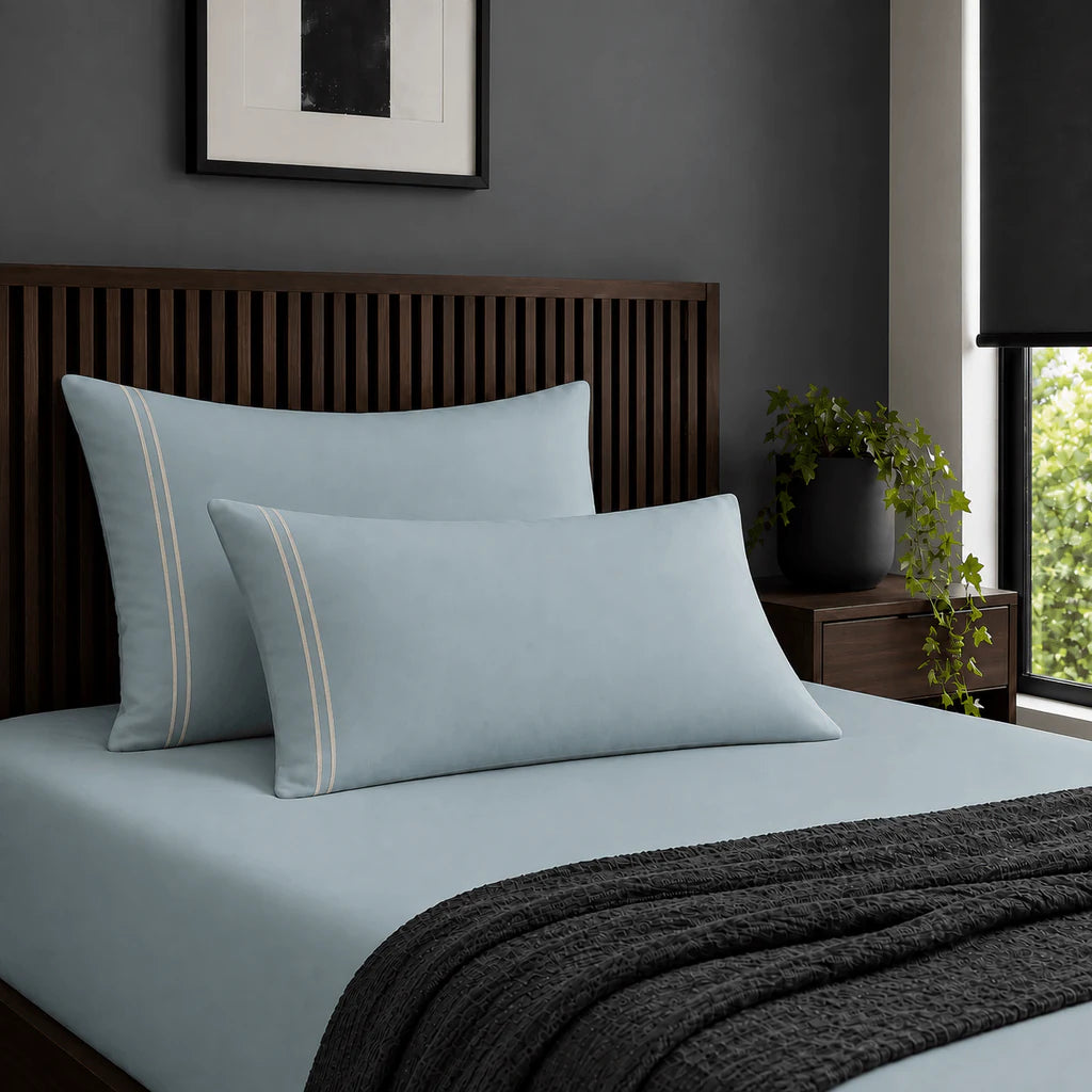 Plain duck egg 200TC 100% cotton percale pillowcases with two row cream satin stitch border by Linen and Co