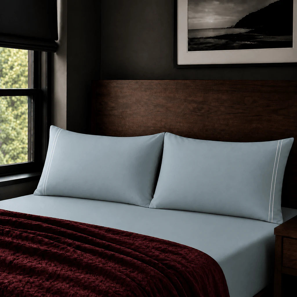 Plain duck egg 200TC polycotton percale pillowcases with two row white satin stitch border by Linen and Co