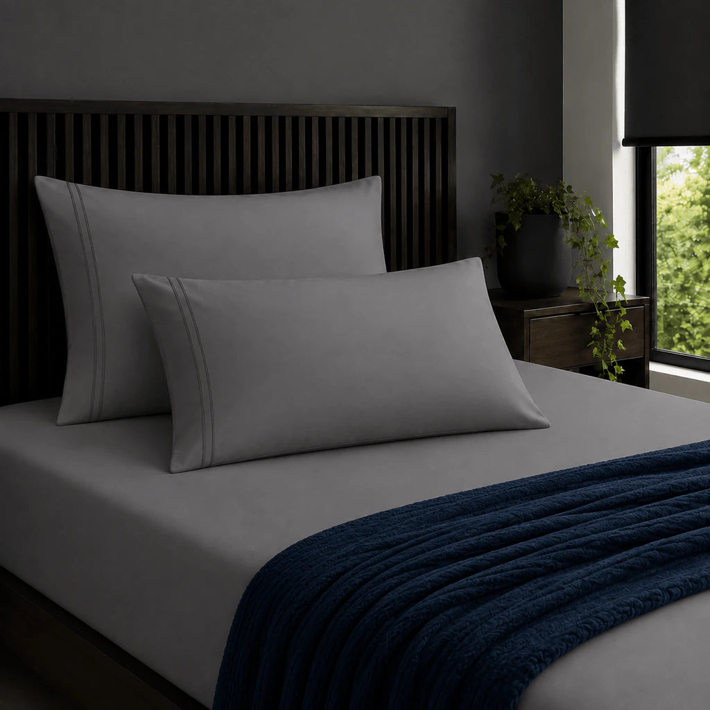 Plain grey 200TC 100% cotton percale pillowcases with two row grey satin stitch border by Linen and Co