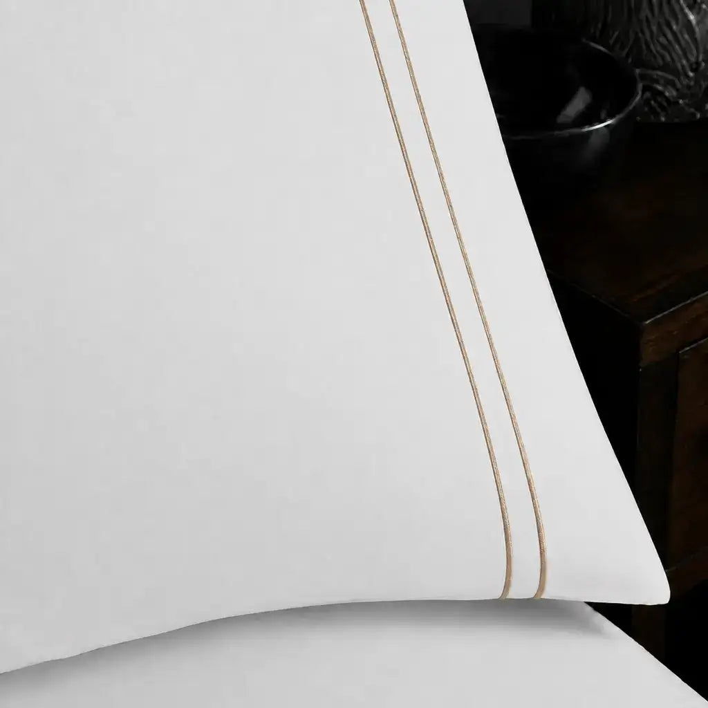 Close-up of white pillowcase with two row stone satin stitch border by Linen and Co
