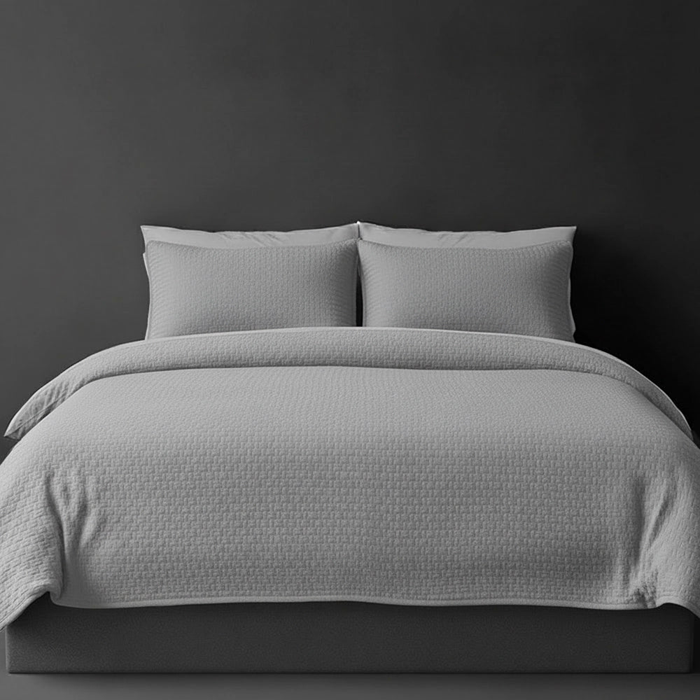 Platinum Grey Berlin bedspread on bed by Linen and Co - luxury hospitality bedspread with textured finish