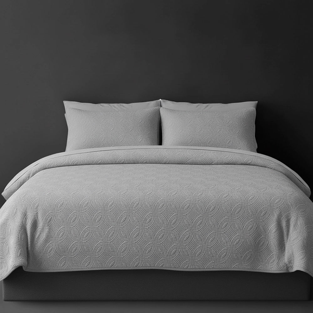 Platinum Grey Munich bedspread on bed by Linen and Co - luxury hospitality bedspread with textured finish