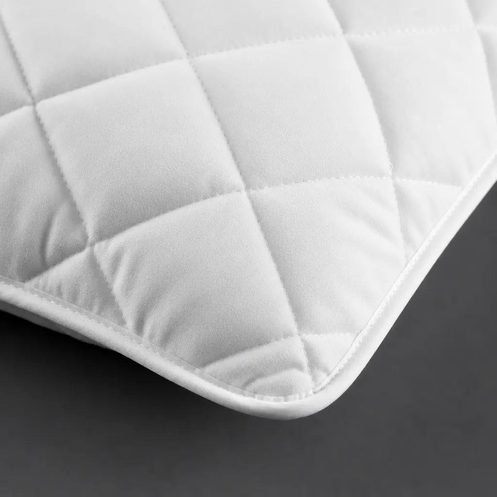 Close-up of white diamond quilting on the Linen and Co Wetsafe pillow protector