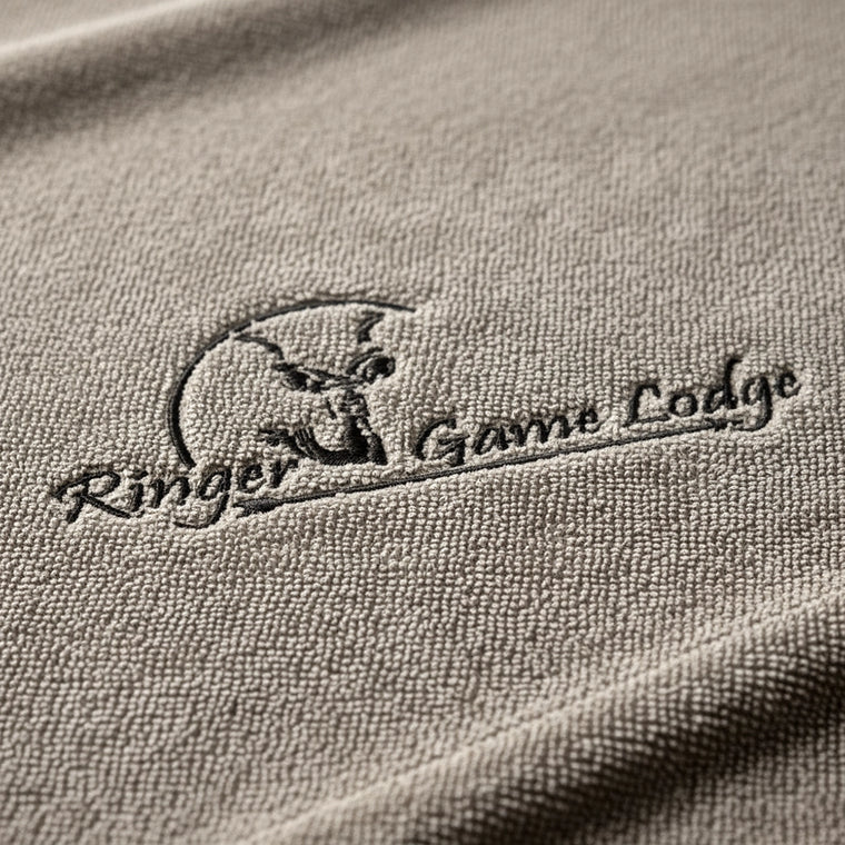 Logo embroidered on stone towelling
