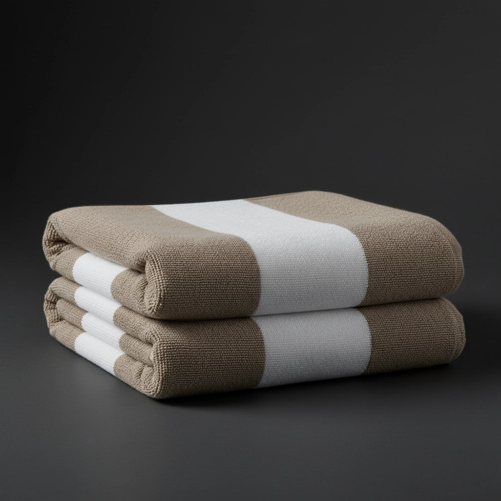 Stone and white broad stripe pool towels stacked - premium hospitality pool linen by Linen and Co