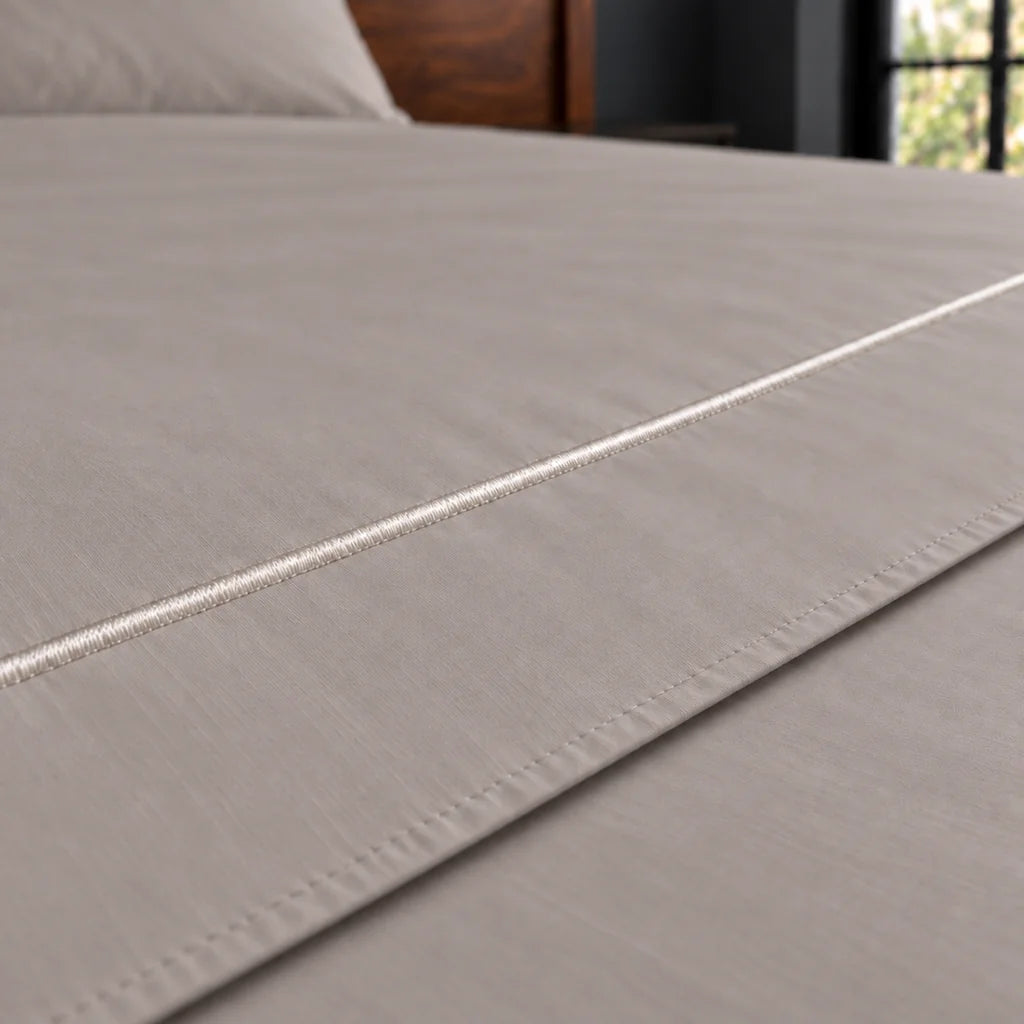 stone cotton percale 200tc flat sheet, one row white satin stitch — close up — Linen and Co
