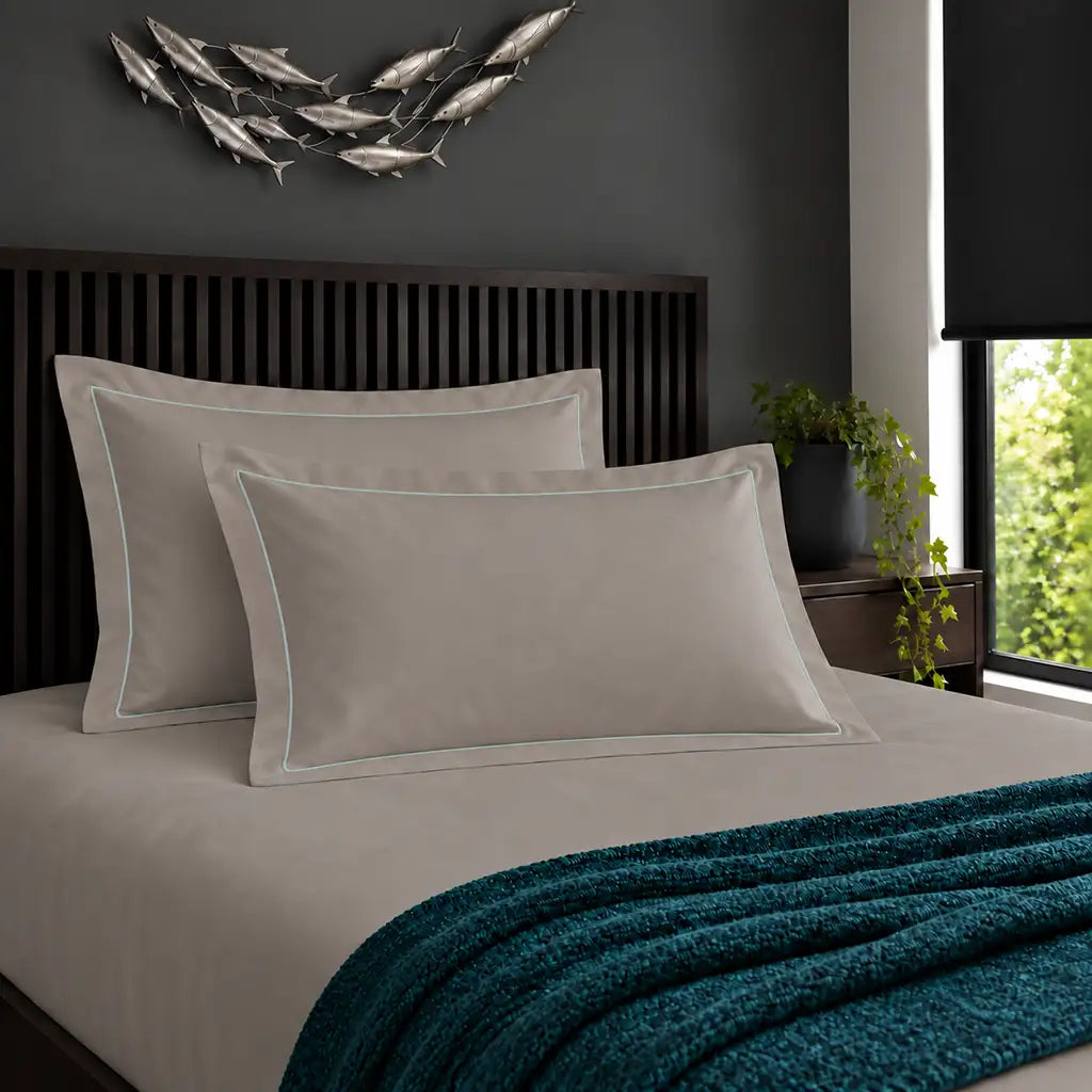 Oxford stone 200TC cotton percale pillowcases with one row duck egg satin stitch border by Linen and Co