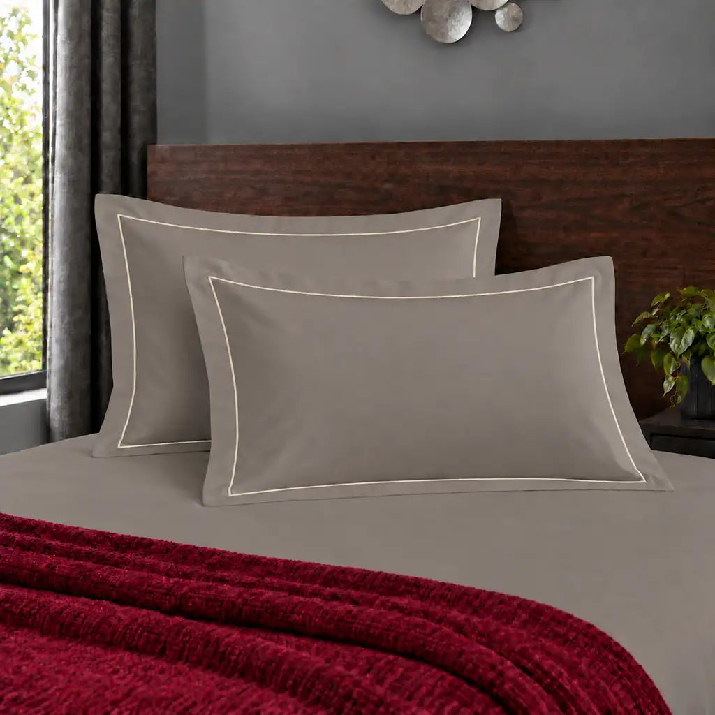 Oxford stone 200TC polycotton percale pillowcases with one row cream satin stitch border by Linen and Co