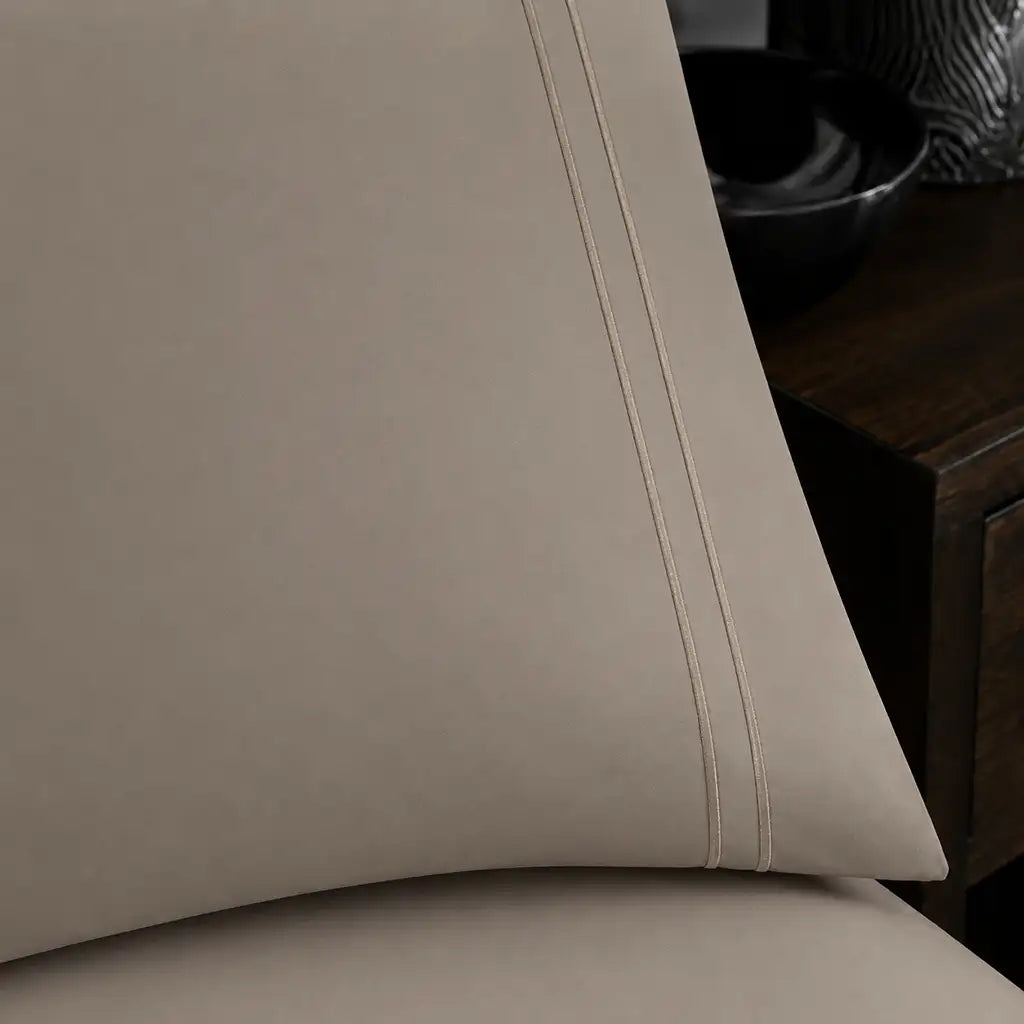 Close-up of a Stone Polycotton Percale 200TC pillowcase edge with two row of Stone satin stitch.