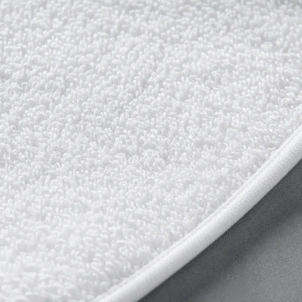 Close-up of white terry towelling on the Linen and Co Wetsafe mattress protector