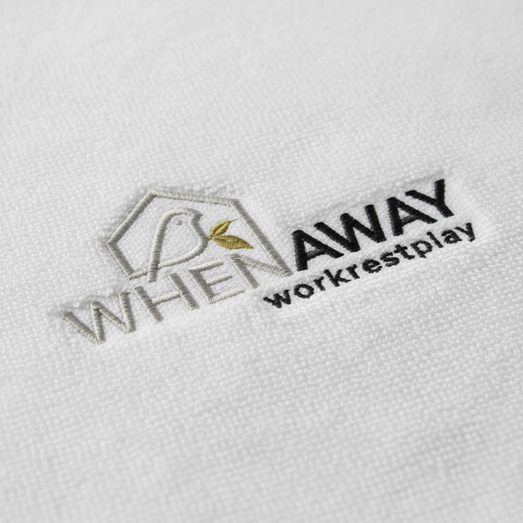 Logo embroidered on white towelling