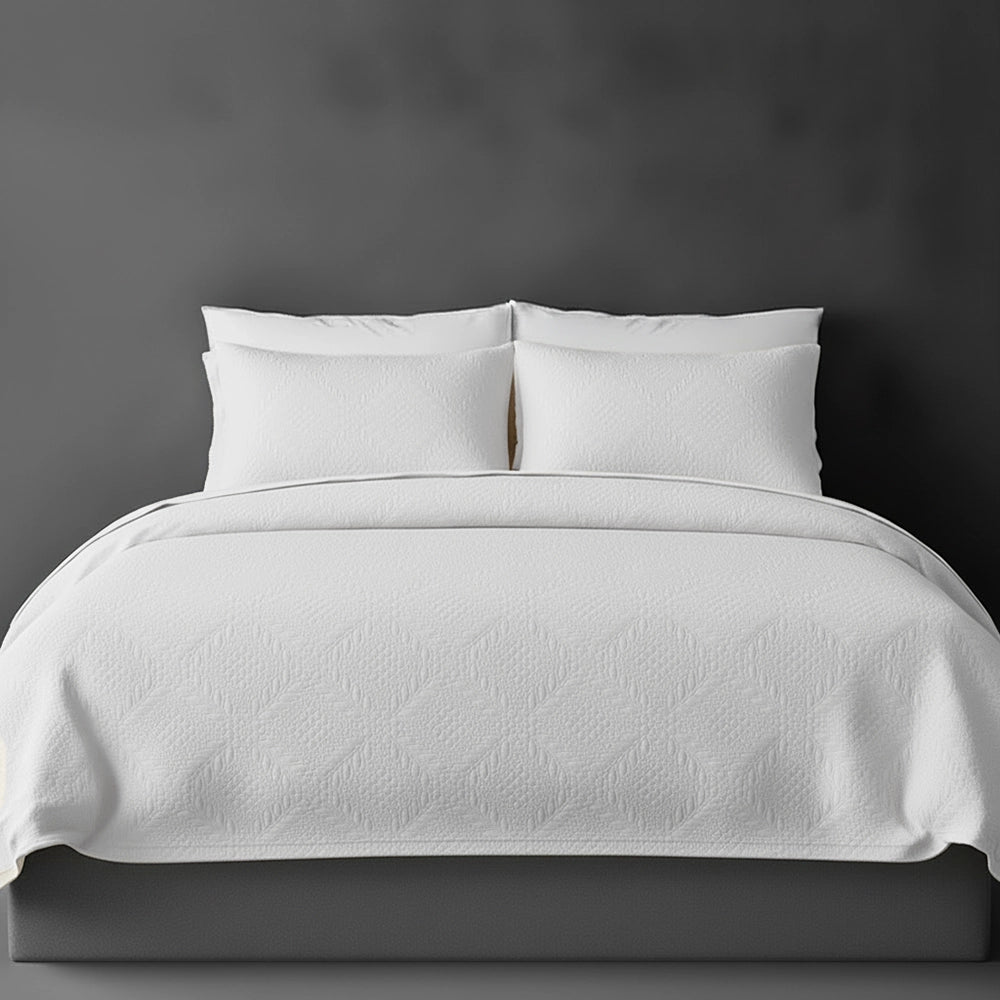 White Istanbul bedspread on bed by Linen and Co - luxury hospitality bedspread with textured finish