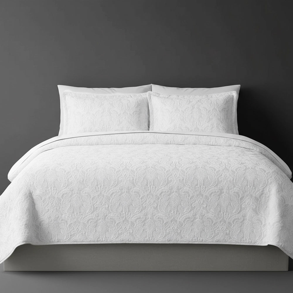 White Kensington bedspread on bed by Linen and Co - luxury hospitality bedspread with textured finish