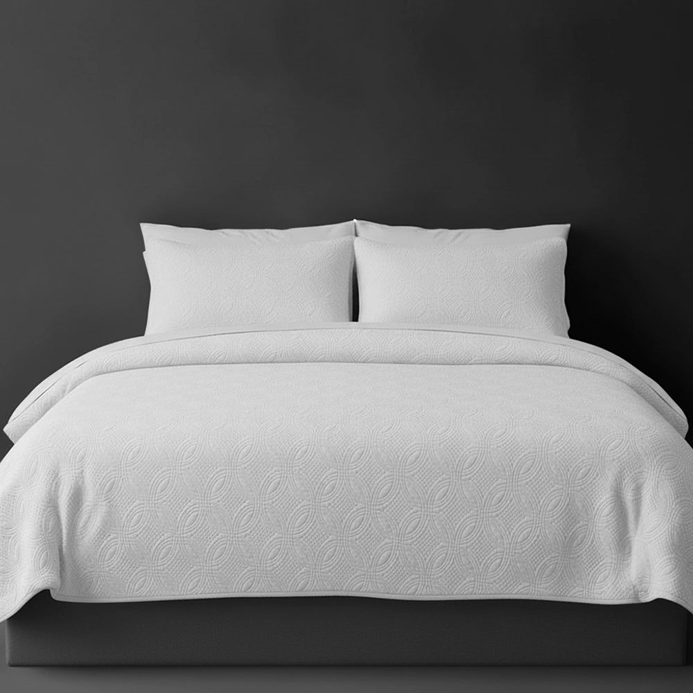 White Munich bedspread on bed by Linen and Co - luxury hospitality bedspread with textured finish