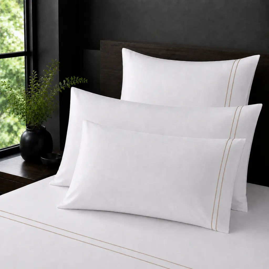 White Polycotton Percale 200TC pillow cases with stone two row satin stitch - on the bed - Linen and Co