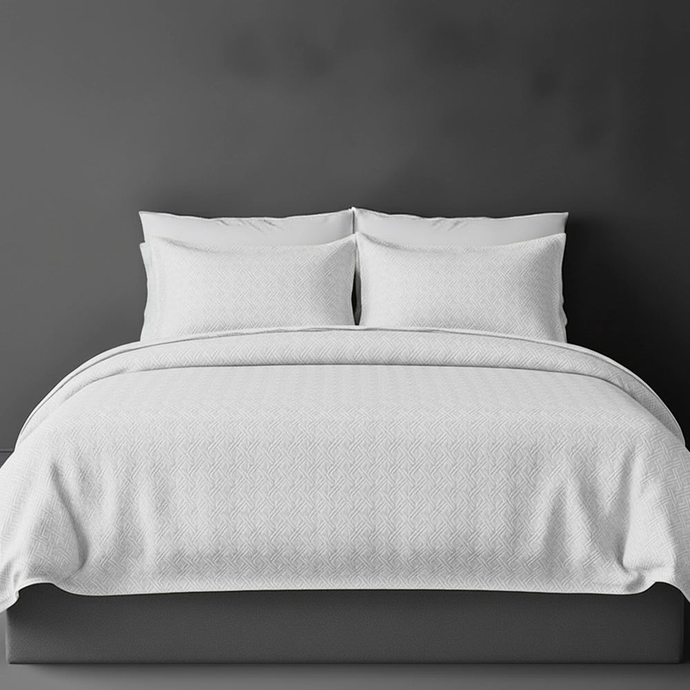 White Rome bedspread on bed by Linen and Co - luxury hospitality bedspread with textured finish