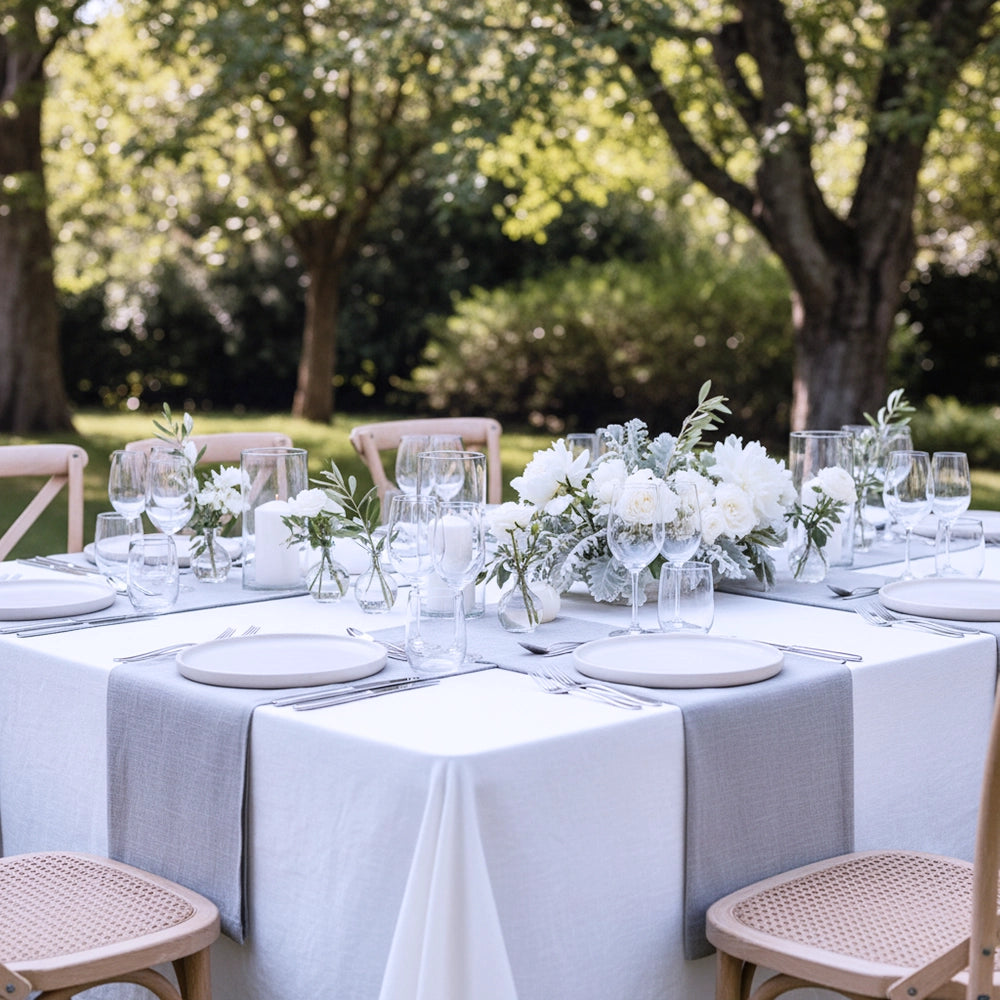Elegant outdoor setup with premium white table linen by Linen and Co - luxury hospitality event linen