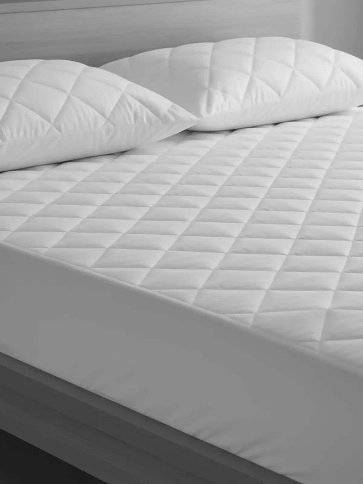 White quilted mattress and pillow protectors